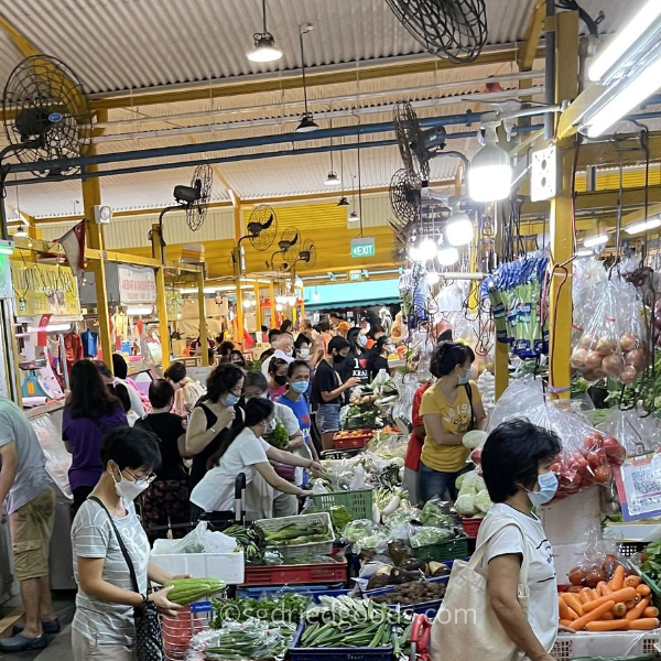 Crowded Wet Market, customers selecting vegetables