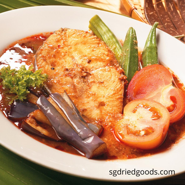 A plate of Asam Fish with assorted vegetables