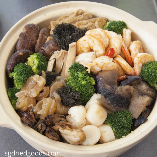 A pot of assorted seafood with vegetables