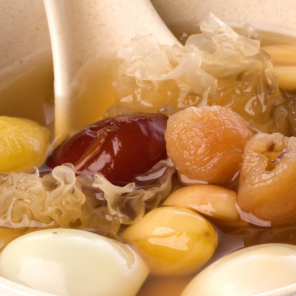Closed up photo of snow fungus dessert with red dates, gingko nuts